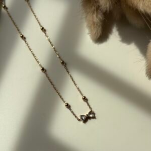 Bow pendent white stone