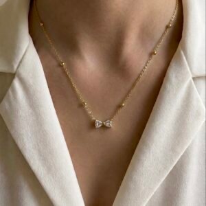Bow pendent white stone