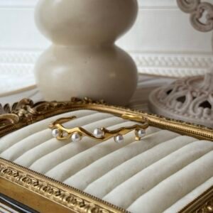 Gold wavy pearl cuff bracelet