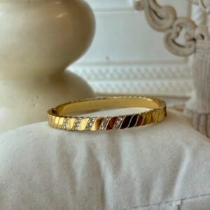 Diagonal stone-set gold bangle thin wrist