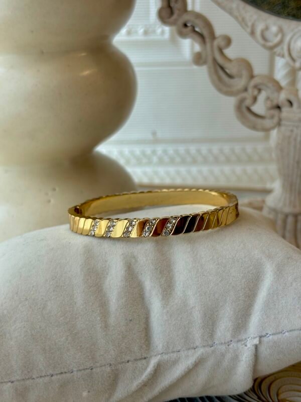 Diagonal stone-set gold bangle thin wrist